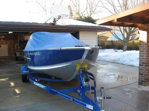 Should I tow my boat w/ or w/o cover on?