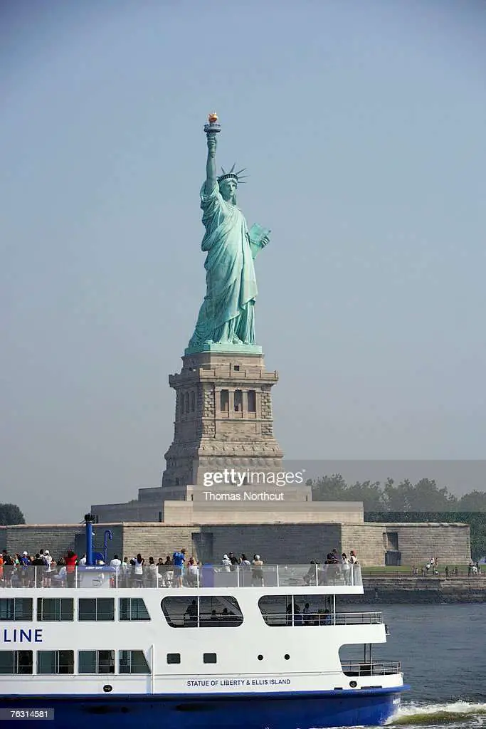 Usa New York City Tour Boat With Statue Of Liberty In Background Stock ...